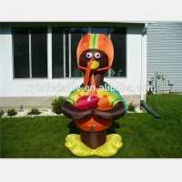 giant inflatable turkey hodling football Thanksgiving inflatables